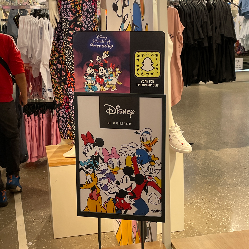 A billboard in a Primark store with QR code to the Disney friendship quiz on Snapchat